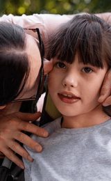 Girl with mum in wheelchair assistance accessibility1920w x 900h px